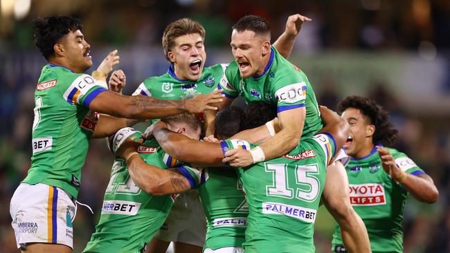 CANBERRA, AUSTRALIA - APRIL 14: Raiders players celebrate a field goal by Jamal Fogarty during the round six NRL match between Canberra Raiders and Gold Coast Titans at GIO Stadium, on April 14, 2024, in Canberra, Australia. (Photo by Mark Nolan/Getty Images)