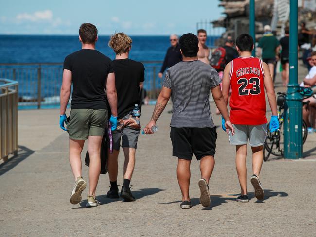 Year 12 students on litter duty at Bronte Beach today.PARENTS have slammed an elite private school's decision to make Year 12 students pick up litter like prisoners doing community service instead of attending an end of school BBQ. Picture:Justin Lloyd