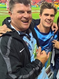 Papenhuyzen with father Neil after an under 18s Blues clash with Queensland.