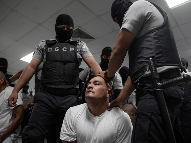The arrival of alleged members of the Venezuelan criminal organisation Tren de Aragua at the Terrorism Confinement Center (CECOT) in the city of Tecoluca, El Salvador. Picture: AFP