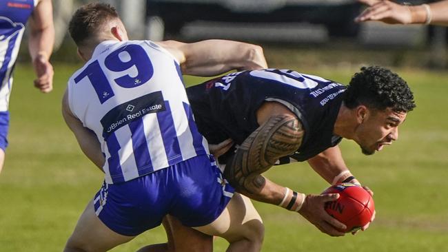 MPFNL: Rosebud’s Tyrell Lafituanai tries to escape. Picture: Valeriu Campan