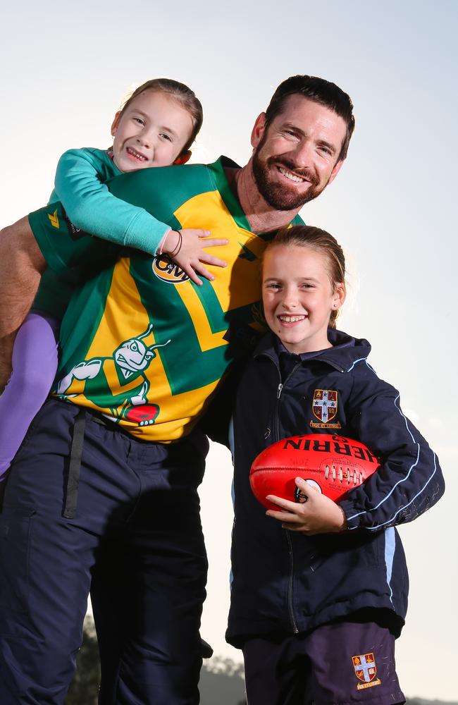 Jason Akermanis — with daughters Sienna, 6, and Charlotte, 10 — is now coaching North Albury in the Ovens and Murray League. Picture: Simon Dallinger