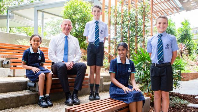 Matthew Flinders Anglican College had some outstanding Naplan results over the last five years. From left, Ayanna Afraz (Year 3), college principal Stuart Meade, Cade Hartley (Year 5), Nethra Chandrasekar (Year 9) and Xavier McFarlane (Year 7).