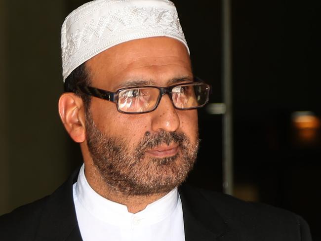 Sheik Man Haron Monis leaves Downing Centre Court after pleading guilty to sending offensive letters to families of dead Diggers.