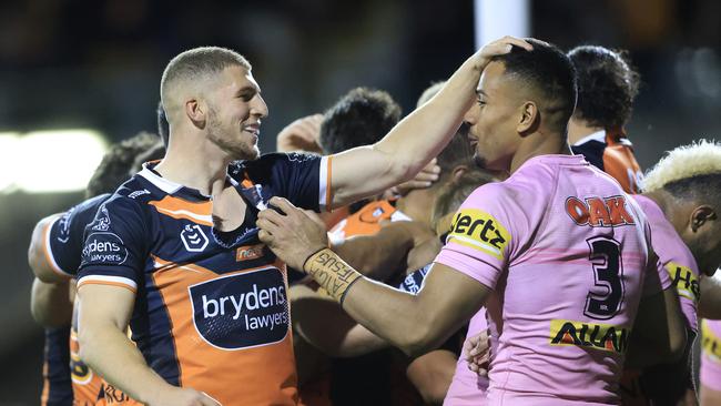 Adam Doueihi of the Tigers taunts Stephen Crichton of the Panthers after a Tigers try. Picture: Mark Evans/Getty Images