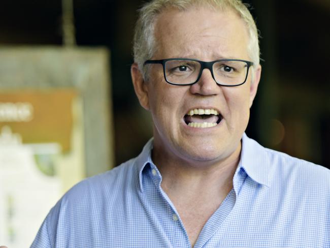 Australian Prime Minister Scott Morrison during a press conference at the Bowali Visitor Centre, Jabiru in the Northern Territory on Sunday, January 13, 2019.  The federal government will invest $216 million in the Northern Territory's Kakadu National Park to improve road access and tourist facilities. (AAP Image/ Michael Franchi) NO ARCHIVING