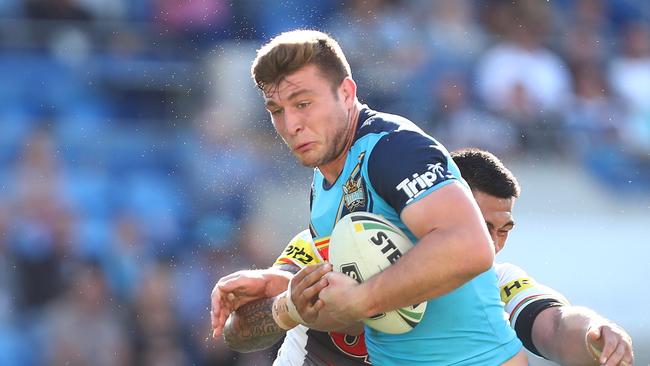 GOLD COAST, AUSTRALIA - AUGUST 11: Jai Arrow of the Titans is tackled during the round 22 NRL match between the Gold Coast Titans and the Penrith Panthers at Cbus Super Stadium on August 11, 2018 in Gold Coast, Australia. (Photo by Chris Hyde/Getty Images)