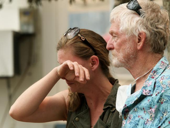 Pat Guest comforts his daughter, Alice Guest, after they lost their family home near Bobin. Picture: Peter Lorimer