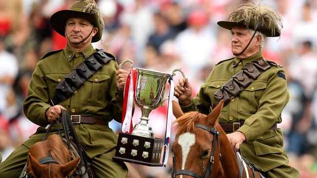 Light Horse Brigade reenactors deliver the Anzac Day trophy ahead of yesterday’s match between the St George Illawarra Dragons and the Sydney Roosters at Allianz Stadium in Sydney. Picture: Dan Himbrechts/AAP