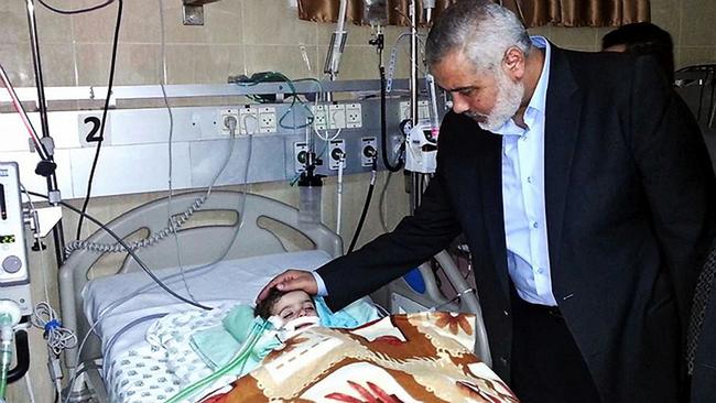 Ismail Haniyeh visits his granddaughter Aamal at a hospital in Gaza in 2013.