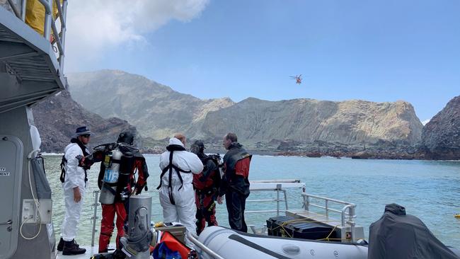 Police divers prepare to search the waters near White Island off the coast of Whakatane, New Zealand.