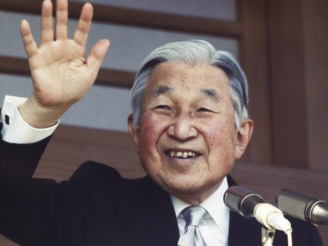 FILE - In this Jan. 2, 2016, file photo, Japan's Emperor Akihito waves to well-wishers from a bullet-proofed balcony of the Imperial Palace during New Year's public appearance in Tokyo. Japan's parliament on Friday, June 9, 2017 passed a law allowing Emperor Akihito to become the first monarch to abdicate in 200 years. (AP Photo/Koji Sasahara, File)