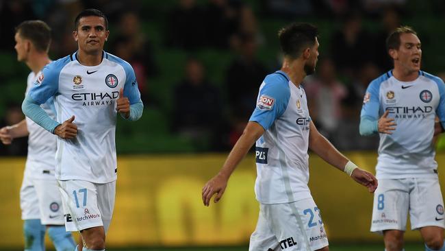 Tim Cahill of City (second from left) reacts after Glory scored their second goal.