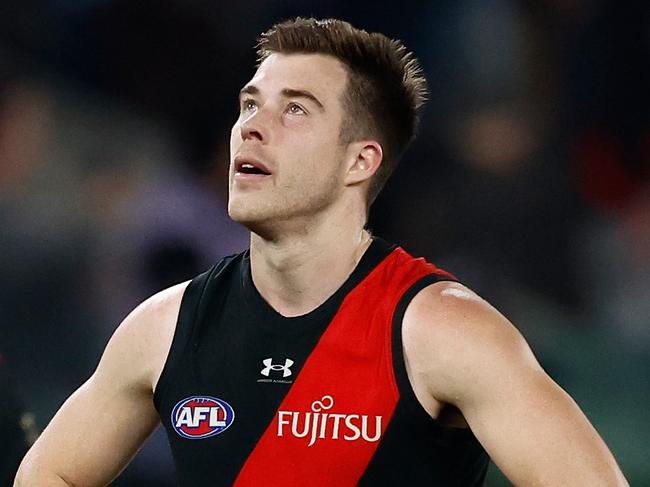 MELBOURNE, AUSTRALIA - AUGUST 10: Zach Merrett of the Bombers looks dejected after a loss during the 2024 AFL Round 22 match between the Essendon Bombers and the Gold Coast SUNS at Marvel Stadium on August 10, 2024 in Melbourne, Australia. (Photo by Michael Willson/AFL Photos via Getty Images)