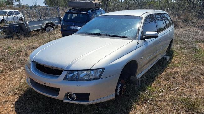 Unregistered, five door wagon, silver Holden Commodore.