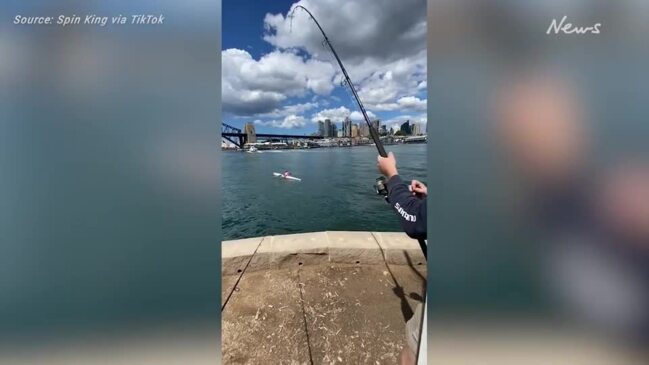 Fisherman hooks irate kayaker