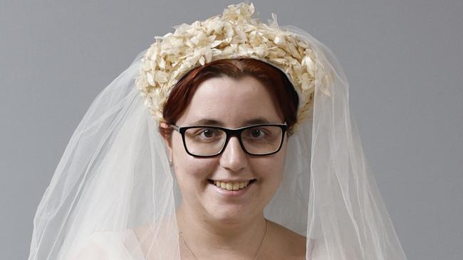 Sam De Cicco models a wedding dress and veil that is on sale for $220 from the St Vincent de Paul society's opportunity shop at the Showgrounds Shopping Centre, Mulgrave Road, Bungalow. Picture: Brendan Radke