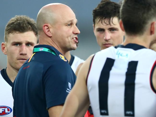 GOLD COAST, AUSTRALIA - JUNE 21: Crows coach Matthew Nicks talks to his team during the round 3 AFL match between the Gold Coast Suns and the Adelaide Crows at Metricon Stadium on June 21, 2020 in Gold Coast, Australia. (Photo by Jono Searle/AFL Photos/via Getty Images )