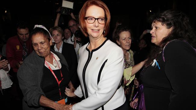 Julia Gillard is mobbed as she leaves the Great Hall after delivering a National Apology on Forced Adoption at Parliament House in Canberra.