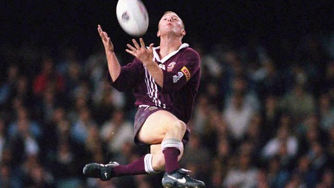 Darren Lockyer leaps for a high ball