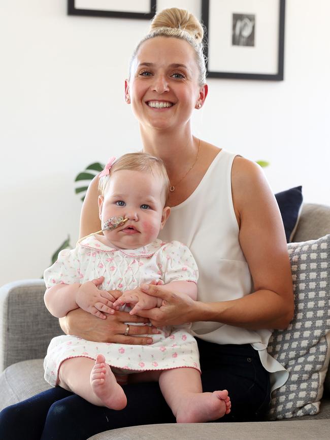 Erin Oudshoorn with her daughter Luella, who takes medicinal cannabis to prevent seizures. Picture: Tim Hunter