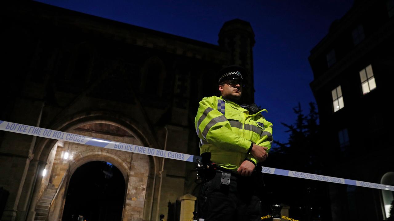 A police officer at the entrance to Forbury Gardens, where the attack occurred.