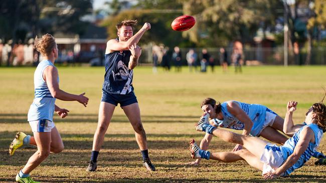 Henley’s Brodie Kitto avoids a tackle from Sacred Heart Old Collegians’ Shaun Tapp during the sides’ division two, round two Adelaide Footy League match. Picture: Matt Loxton