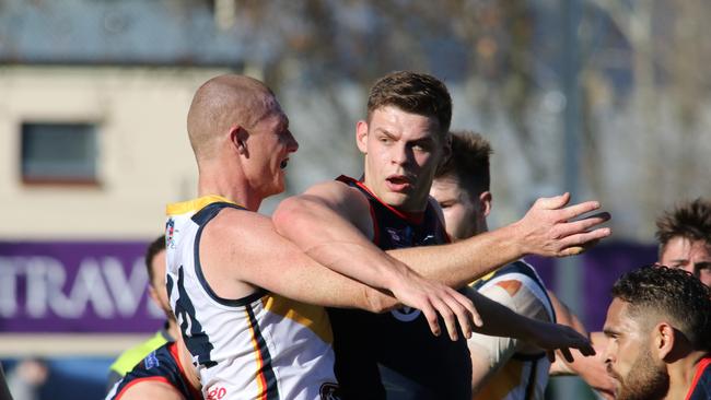 Sam Jacobs tussles with Norwood's Luke Surman. Picture: AAP Image/Russell Millard