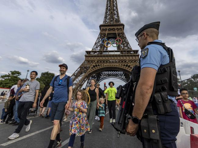 PARIS, FRANCE - JULY 17: Policeman stands guard at the bridge near Eiffel tower on July 17, 2024 in Paris, France. (Photo by Maja Hitij/Getty Images)