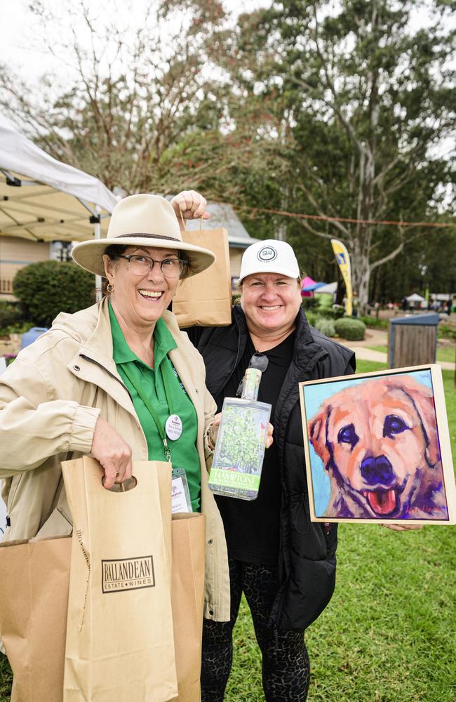 Marie Stuart (left) and Lisa Hayward show their purchases supporting local businesses at the Hampton Festival, Saturday, May 17, 2025. Picture: Kevin Farmer