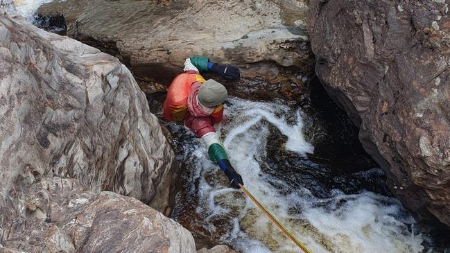 The 69-year-old man was on kayak trip when he slipped and fell into the water becoming wedged between rocks. Pictures: Tasmania Police