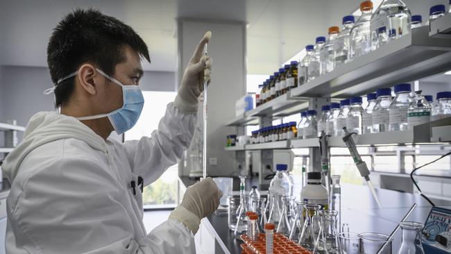 A technician at work for Sinovac Biotech in Beijing. Picture: Getty Images