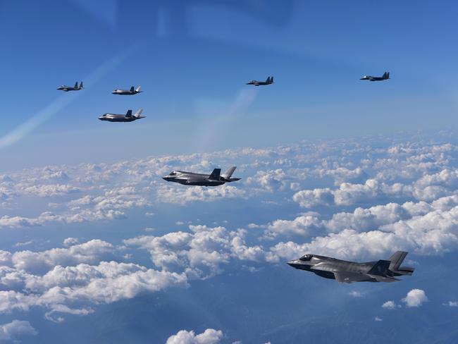 South Korea's F-15K and US F-35B fighter jets in a join training mission. South Korean and Japanese fighters shadowed a joint Chinese-Russia military drill. Picture: Getty Images.