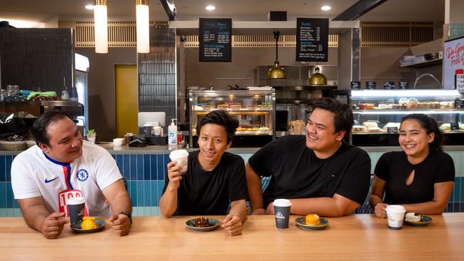 Co-owners Arash Tayebbi and Justin Drennan share a desert with staff Arbin Gurung and Kabita Gautam. Picture: Che Chorley