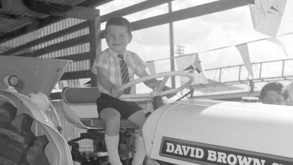 A young boy on a tractor at the show in the 1960s. Picture: Bob Avery