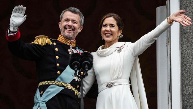 The couple were all smiles on the balcony after the proclamation. Picture: AFP