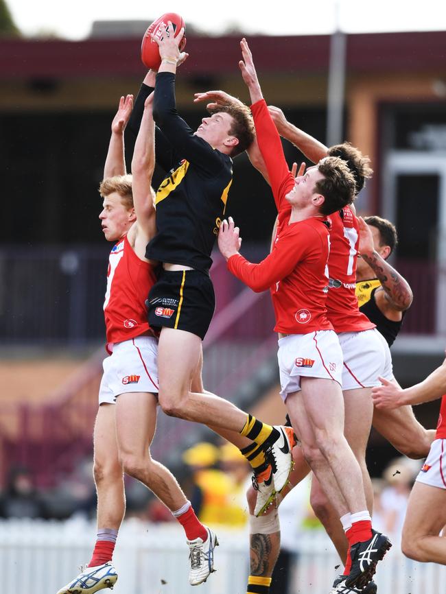 Lachlan Hosie takes a strong mark for Glenelg. Picture: Mark Brake/AAP