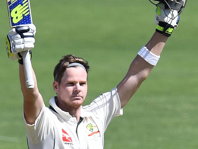 Australia's captain Steve Smith celebrates after scoring a century (100 runs)on the third day of the first cricket Test match between India and Australia at The Maharashtra Cricket Association Stadium in Pune on February 25, 2017. ----IMAGE RESTRICTED TO EDITORIAL USE - STRICTLY NO COMMERCIAL USE----- / GETTYOUT / AFP PHOTO / INDRANIL MUKHERJEE / ----IMAGE RESTRICTED TO EDITORIAL USE - STRICTLY NO COMMERCIAL USE----- / GETTYOUT