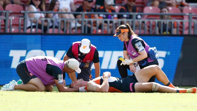 SYDNEY, AUSTRALIA - MARCH 09: Kieren Briggs of the Giants is seen injured during the 2025 AFL Opening Round match between the GWS Giants and the Collingwood Magpies at ENGIE Stadium on March 9, 2025 in Sydney, Australia. (Photo by Michael Willson/AFL Photos via Getty Images)