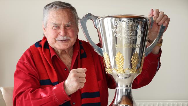 EMBARGOED UNTIL MONDAY 11th Oct. Melbourne Football Club gives legend Ron Barassi the 2021 AFL Trophy to hold at his home.                     Picture: David Caird