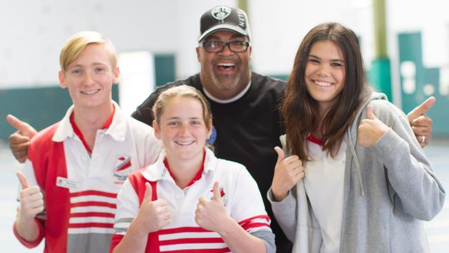 Reggie Dabbs after speaking at Urangan State High School in Hervey Bay in 2014. Pictured with students Matt Ryan, Mikha Bryen and Kerri-Anne Hetherington. Photo: Supplied.