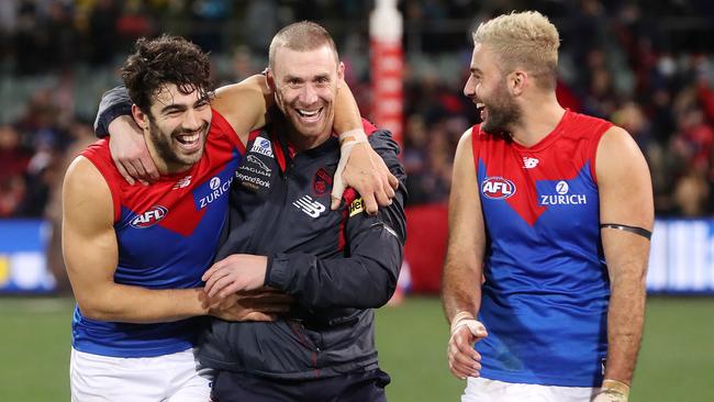 Melbourne coach Simon Goodwin with Christian Petracca, left, and Christian Salem after Thursday’s win. Picture: Sarah Reed/AFL Photos