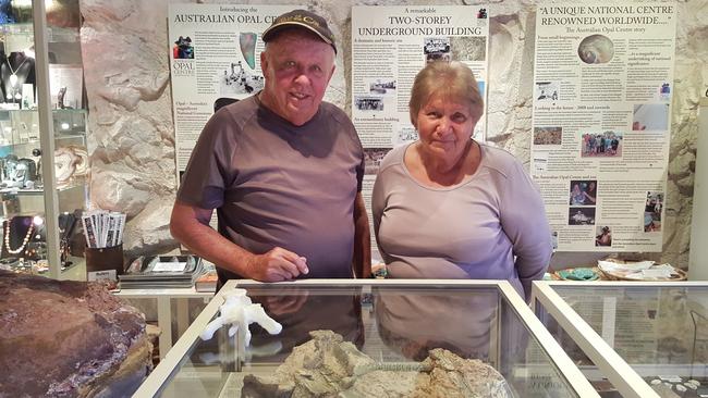 Bob Foster, who discovered the opalised bones of Fostoria dhimbangunmal in the 1980s, with wife Jenny at the Australian Opal Centre. Picture: Jenni Brammal