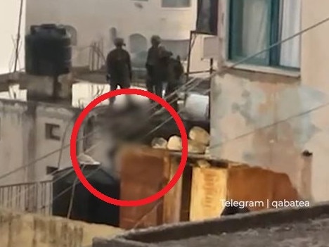 Shock footage of Israeli soldiers kicking dead Palestinian off a roof.