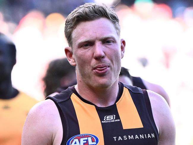 MELBOURNE, AUSTRALIA - MARCH 16: James Sicily of the Hawks and his team mates look dejected after losing the round one AFL match between Essendon Bombers and Hawthorn Hawks at Melbourne Cricket Ground, on March 16, 2024, in Melbourne, Australia. (Photo by Quinn Rooney/Getty Images)