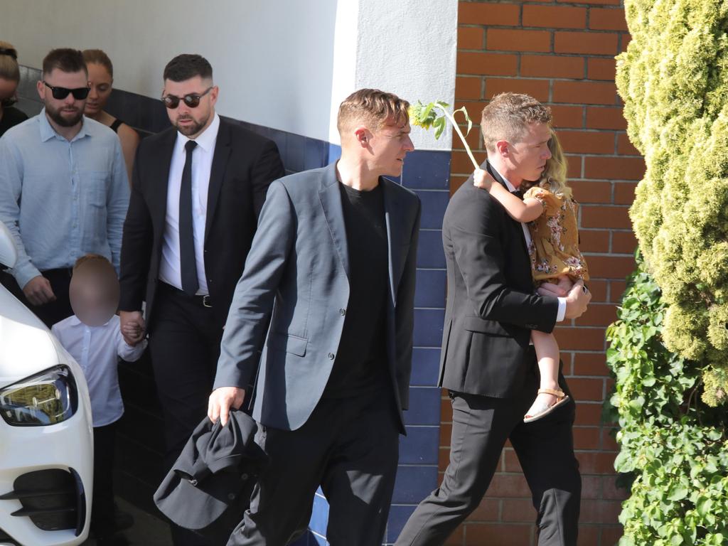 Rohan Dennis with daughter, and son behind, leaving at the end of the service at Fremantle Cemetery. Picture: NCA NewsWire/Philip Gostelow