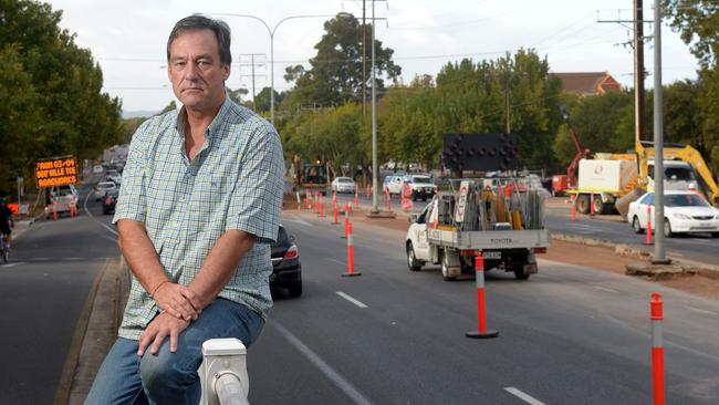 Hackney resident Drew Dawson at the front of his family home on Hackney Rd, where O-Bahn tunnel works are continuing through the night. Pic: Keryn Stevens