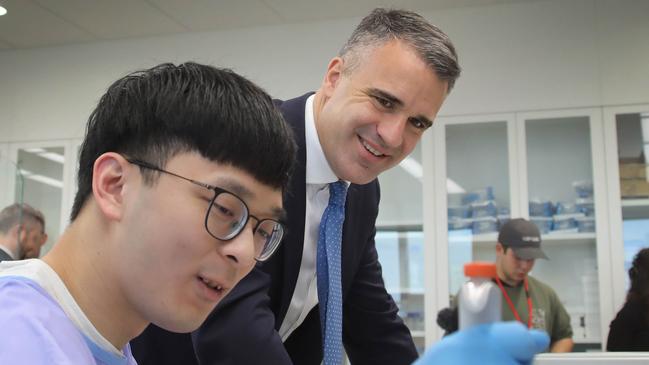 ADELAIDE, AUSTRALIA - NewsWire Photos July 3, 2023: SA Premier Peter Malinauskas, talks to Uni SA PHD student Casper Liu, while on a visit to Uni SAÃs Bradley Lab, with University of Adelaide Vice Chancellor, Prof Peter Hoj & University of Vice Chancellor Prof David Lloyd. Picture: NCA NewsWire / Dean Martin