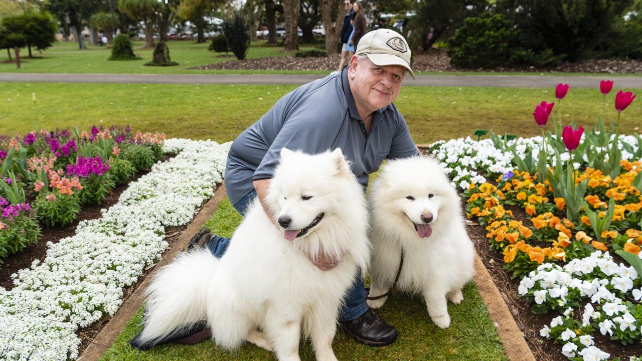 Zeus (left) and Sasha with owner Keith McGinn in Queens Park for the floral display for Carnival of Flowers 2022, Saturday, September 17, 2022. Picture: Kevin Farmer