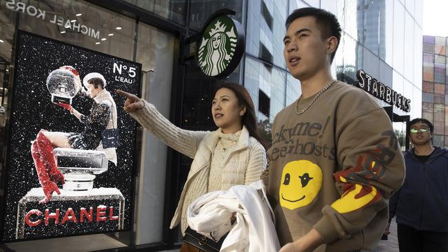 Shoppers visit a popular retail district ahead of Singles Day in Beijing. Picture: AP